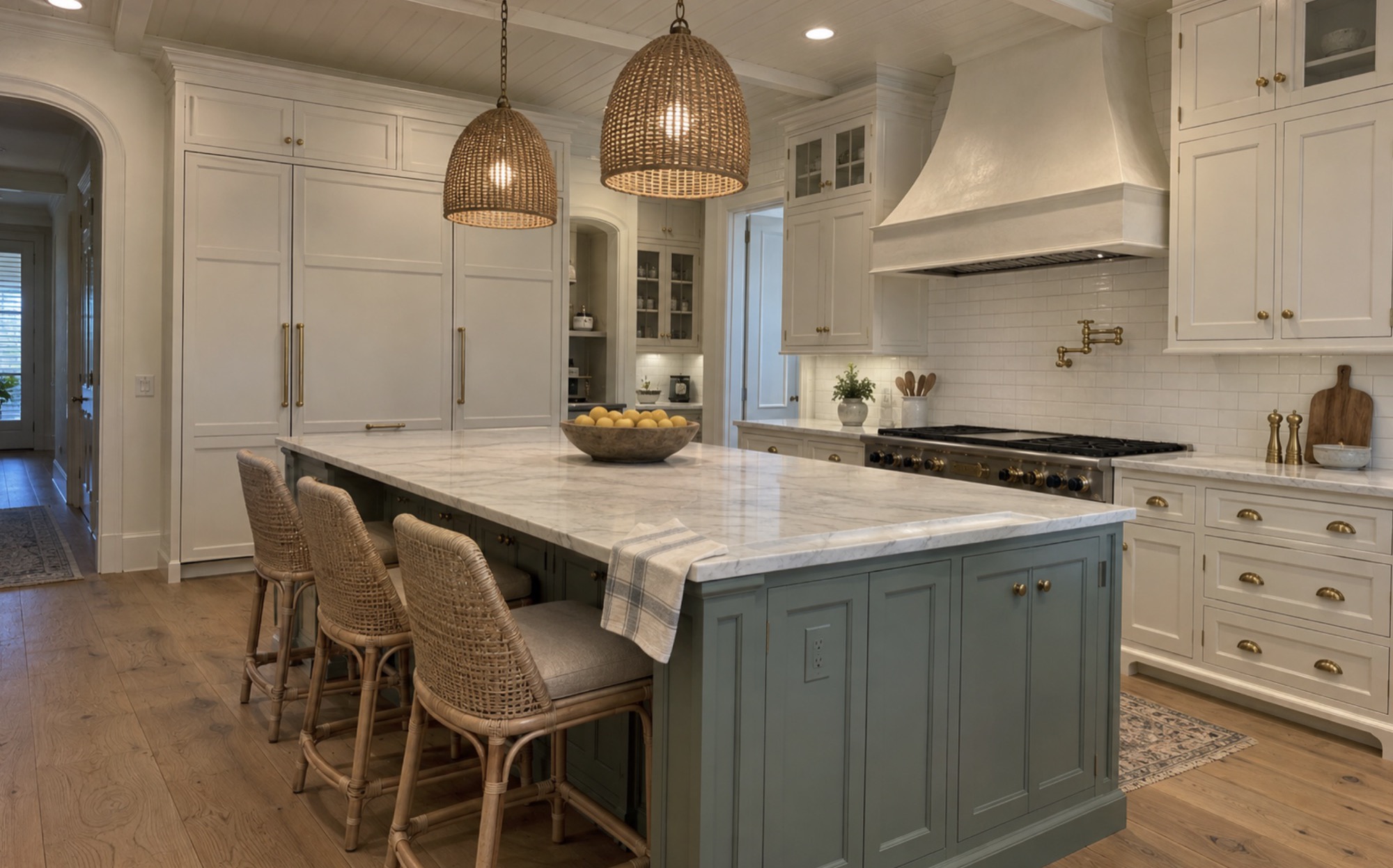 Kitchen in The Strand, Naples, FL after cabinet refinishing by Bryan's Painting and Home Finishes, with white cabinets and the island painted a soft teal
