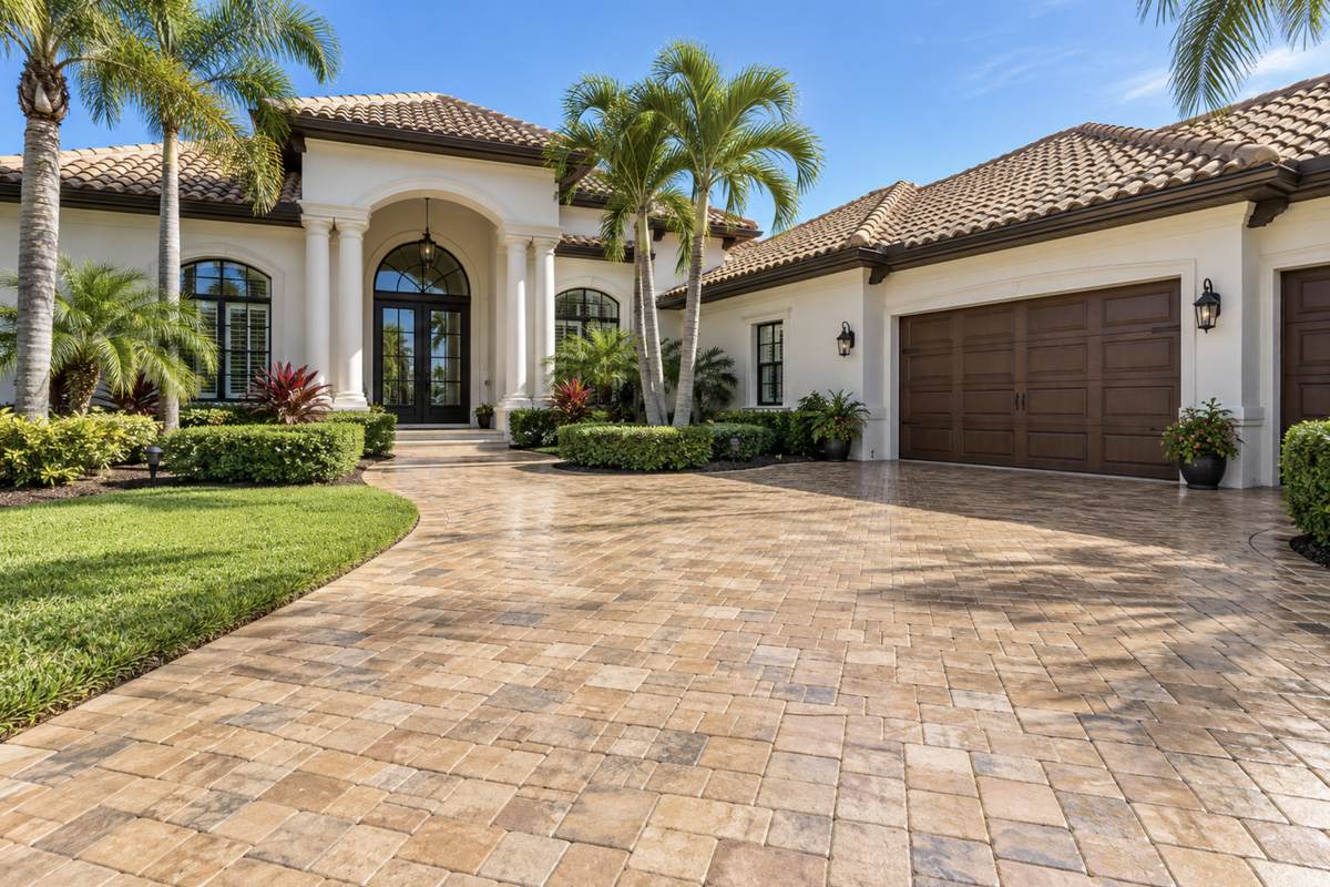 Paver driveway at a home in Bay Colony, Naples, FL after pressure washing by Bryan's Painting and Home Finishes